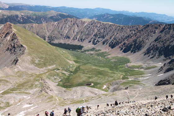 The view hiking back down Grays Peak. There were still a ton of people on the trail heading up as we were heading down. Every switchback was dotted with people. The dark foresty area is were the trailhead is.